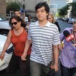Son of accused spies Juan Lazaro and Vicky Peleaz, Juan Jose Lazaro, center, and Peleaz's sister, Raquel Pelaez Ocampo, left.